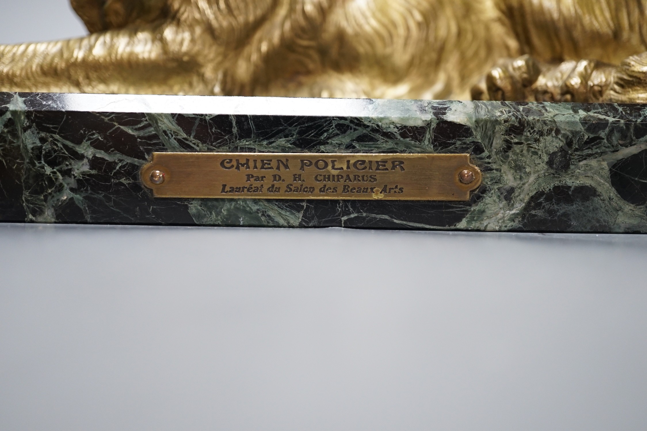 After D H Chiparus, a gilt metal figure of a German Shepherd dog, on marble base, 36 cms wide